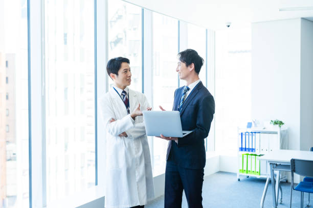 istock Businessman having a meeting with a doctor 2160193055