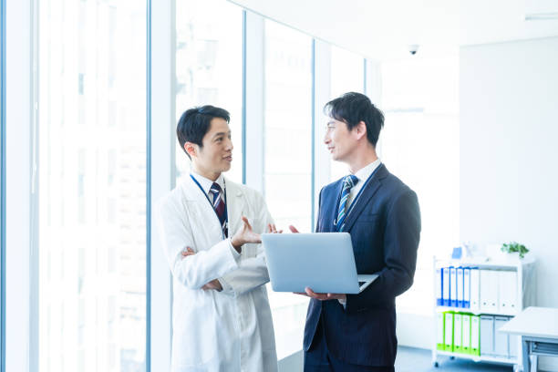 istock Businessman having a meeting with a doctor 2160193056