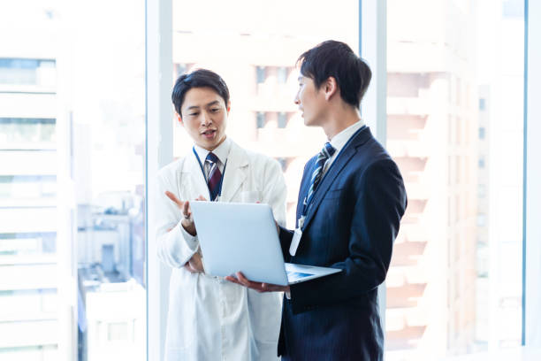 istock Businessman having a meeting with a doctor 2160193061