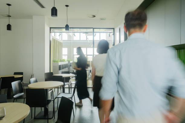 istock Colleagues taking a break in the office cafeteria 2160193276