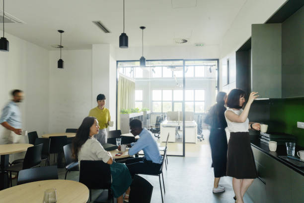 istock Colleagues taking a break in the office cafeteria 2160193299