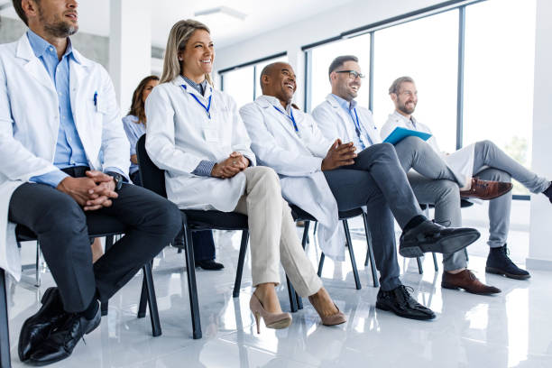 istock Happy medical experts attending an education event in board room. 2160196331