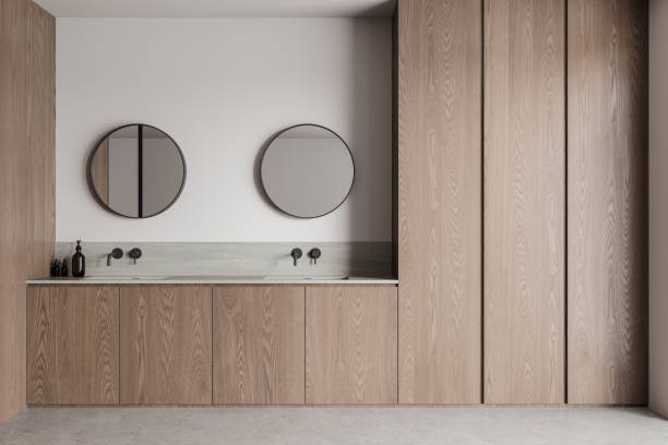 istock Stylish home bathroom interior with double sink and bathing accessories 2160199290