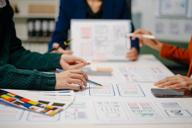 istock Close up view of UI developer team brainstorming on their project with laptop, smartphone and digital tablet. 2160199436