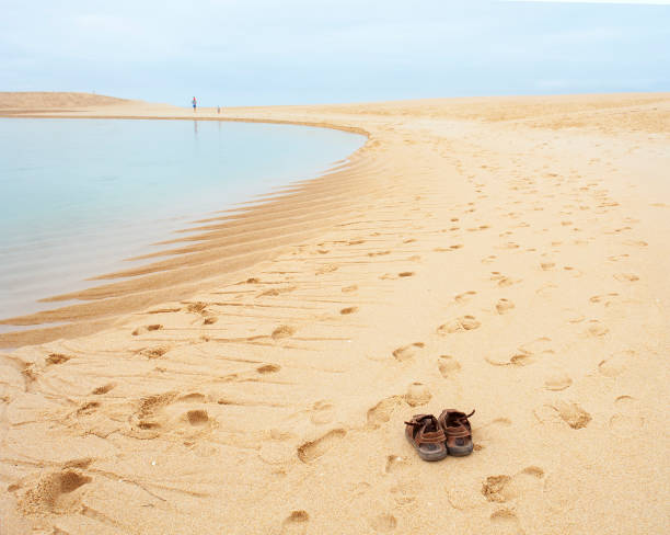 Footprints in front of the sea in the Alentejo of Portugal