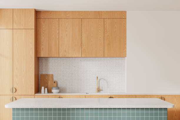 istock Wooden home kitchen interior with bar countertop and sink and kitchenware 2160200287