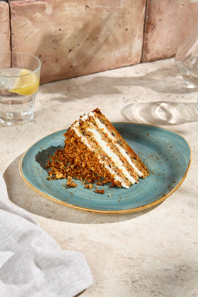 istock Authentic Carrot Cake Slice on Blue Ceramic Plate in Sunlit Aesthetic Still Life 2160200412