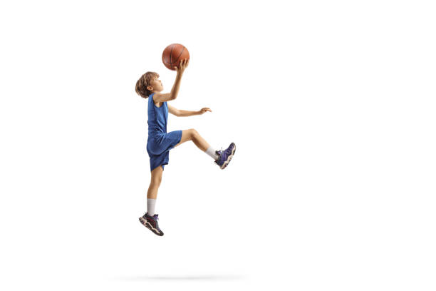 istock Boy jumping with a basketball 2160200741