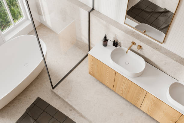 istock Top view of hotel bathroom interior with bathtub, sink and panoramic window 2160200795