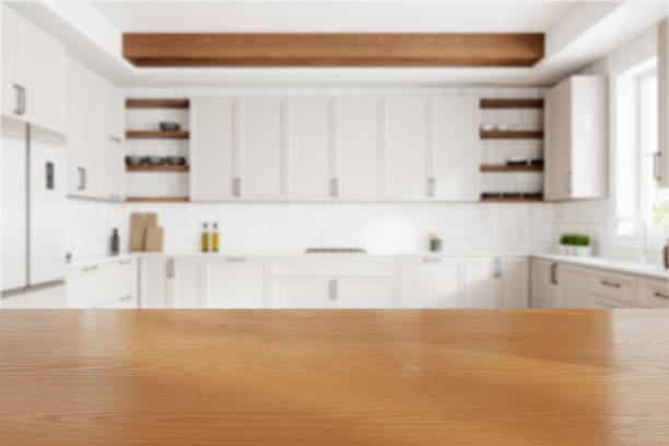 istock Wooden countertop is shown with a blurred modern kitchen background. Bright and airy kitchen concept. 3D Rendering. 2160201276