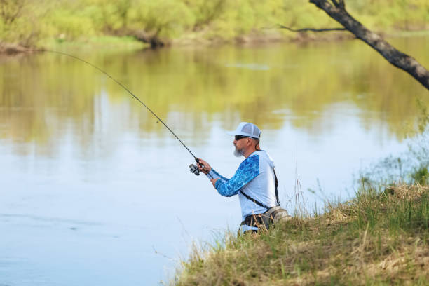 istock Spining fishing, angling, catching fish. Hobby and vacation 2160201467