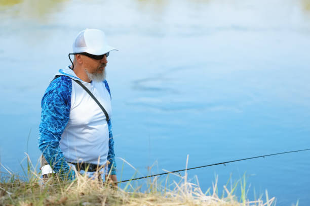 istock Spining fishing, angling, catching fish. Hobby and vacation 2160201474