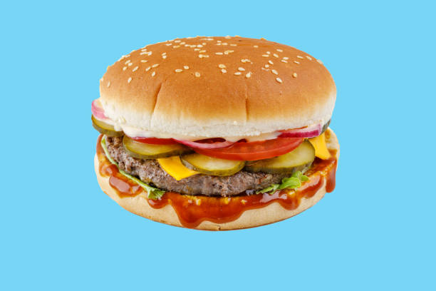 istock hamburger like in McDonald's with a beef cutlet on a blue background, studio shooting 1 2160202883
