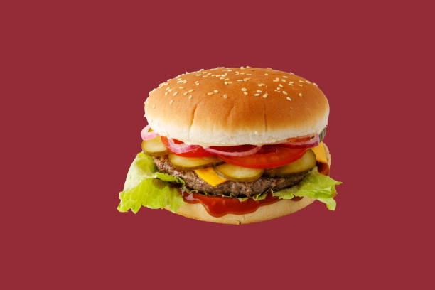 istock hamburger like in McDonald's with a beef cutlet on a red background, studio shooting 2 2160203138