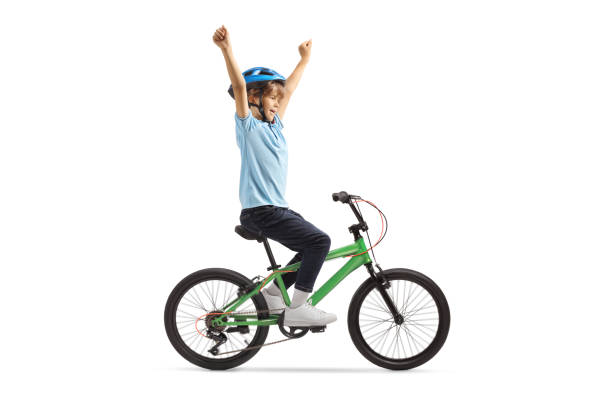 istock Happy boy with a helmet riding a bicycle 2160203634