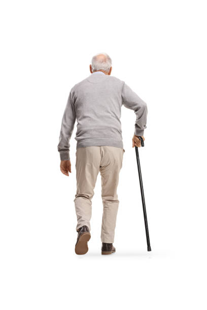 istock Rear view shot of an elderly man walking with a walking cane 2160205370