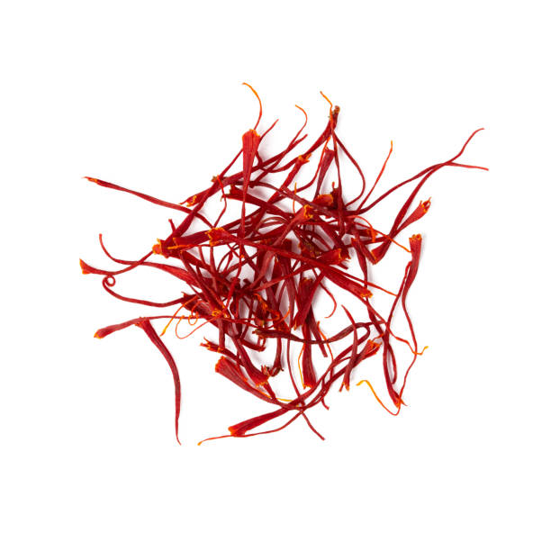 Heap of saffron isolated, directly above. Heap of saffron isolated on white background. Top view, close up. saffron plant stock pictures, royalty-free photos & images
