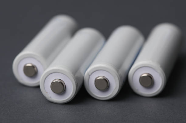AA batteries on a dark gray background.