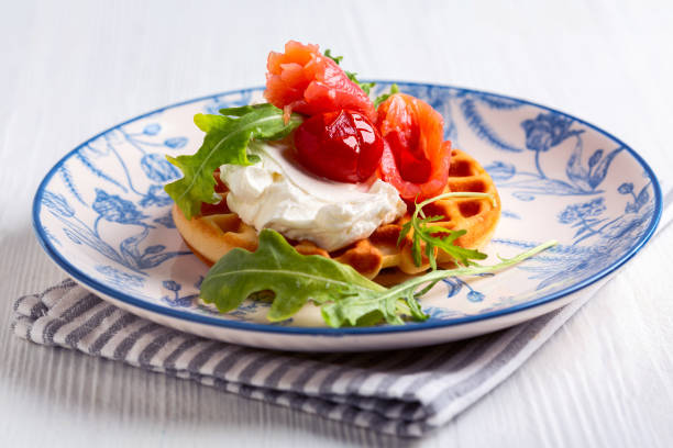 istock Belgian waffles with salmon and cream cheese. 2160212216