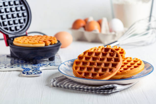 istock Preparation of Belgian waffles. 2160212319