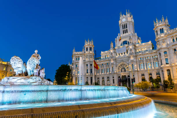 Cibeles fountain shot in the afternoon with water pouring. Symbol of Madrid.