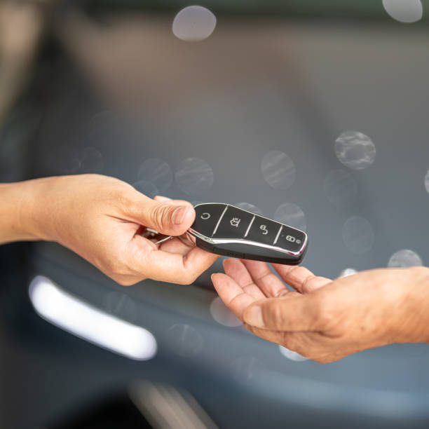 istock Buying a new car, taking the key. 2160215135