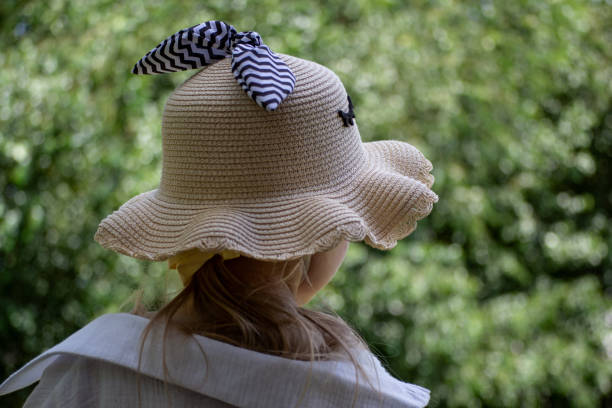 istock girl in a straw hat 2160215298