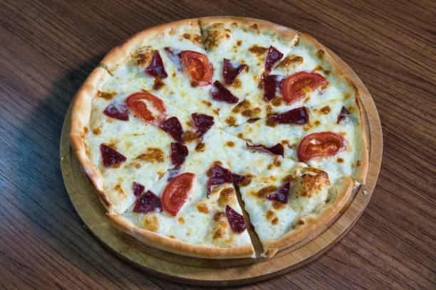 istock Sliced Pizza With Tomato and Salami 2160216511