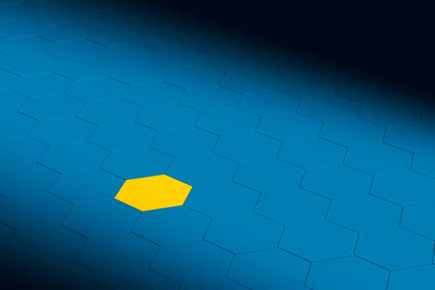 Abstract technology background. 3d illustration of a yellow hexagon standing out from the crowd of blue hexagons. A concept of being different. 3d render.
