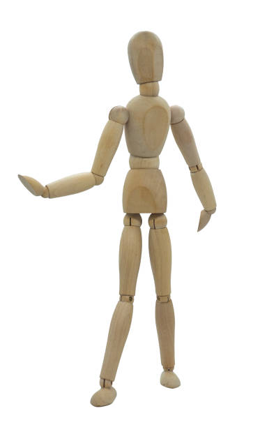 istock Standing wooden jointed figure with one by side and one extended 2160218804