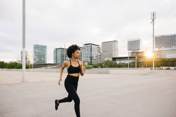 istock Woman running on in a city. 2160218966