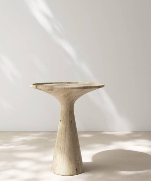 istock Modern, minimal round wooden pedestal table podium in dapple sunlight, shadow on white wall, beige floor 2160222028