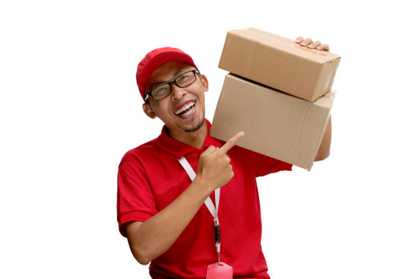 istock Asian Delivery Man Pointing at Cardboard Box Packages 2160222936