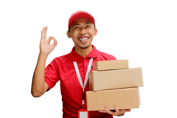 istock Asian Delivery Man Showing OK Gesture with Cardboard Box 2160223270