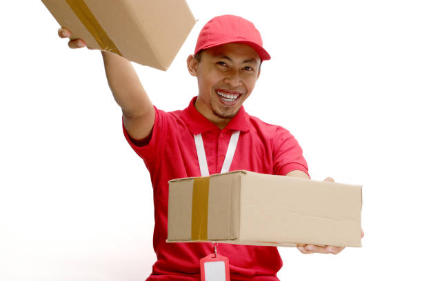 istock Happy Asian Delivery Man Holding Cardboard Box 2160223393