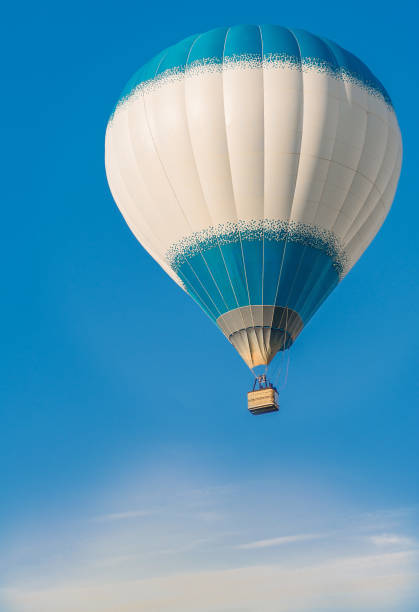 istock One big balloon is floating high in the blue sky 2160223689