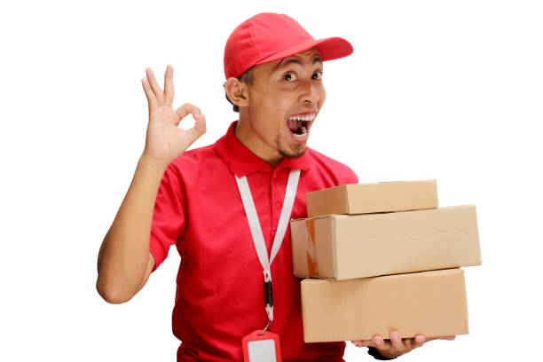 istock Asian Delivery Man Showing OK Gesture with Cardboard Box 2160223718