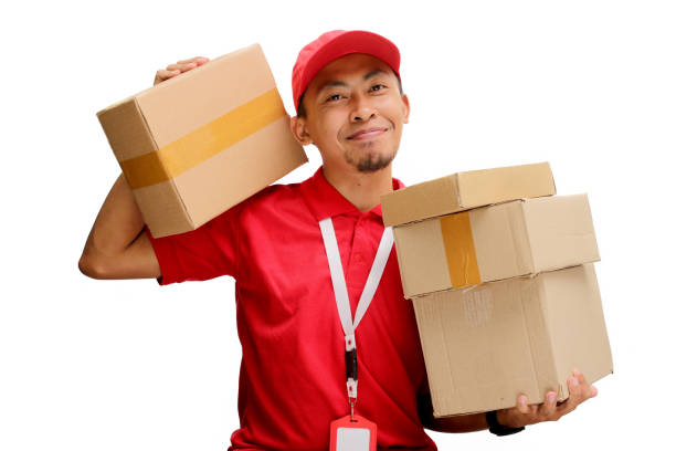istock Happy Asian Delivery Man Holding Cardboard Box 2160224043