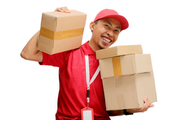 istock Happy Asian Delivery Man Holding Cardboard Box 2160224683