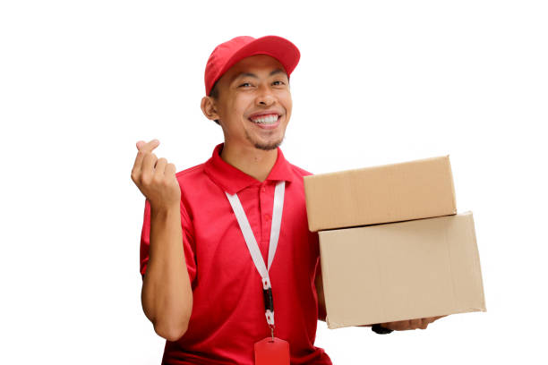 istock Asian Delivery Man Showing Love Gesture with Cardboard Box 2160224856