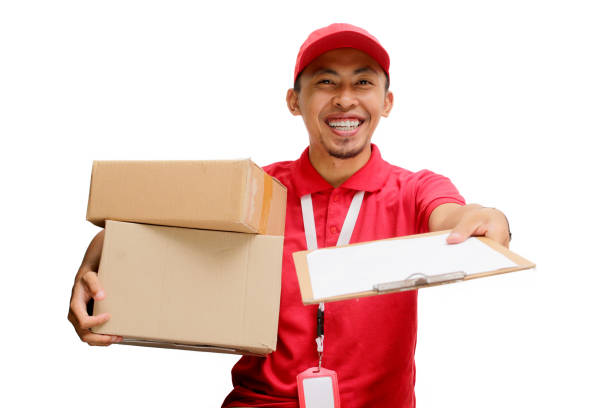 istock Excited Asian Delivery Man Offering Document for Package Receipt 2160225919