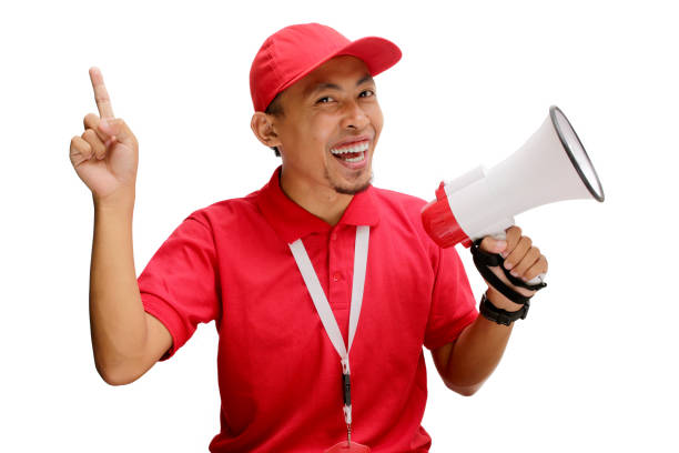istock Asian Delivery Man in Pointing at Copy Space with Megaphone 2160226864