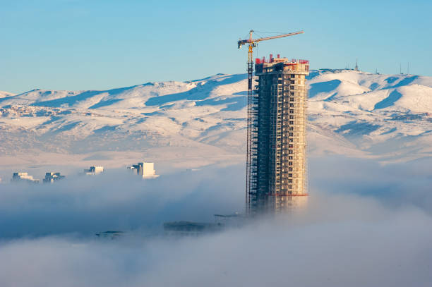 Skyscraper buildings built in winter in fog