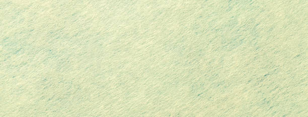 istock Texture of light green and yellow felt background with spots fabric, macro. Woolen olive textile 2160227426