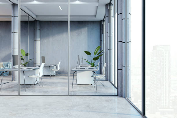 istock An empty modern office interior with desks, chairs, and large windows overlooking a cityscape, concept of corporate space. 3D Rendering 2160228812