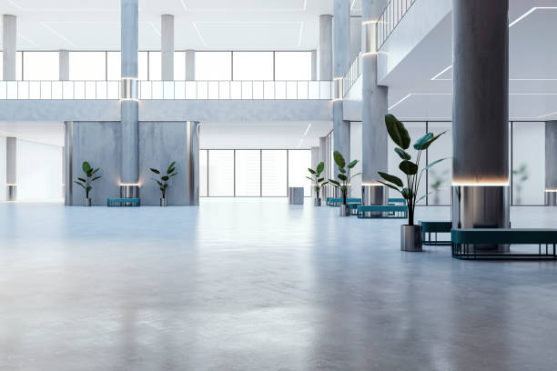 istock An empty modern office building interior with concrete pillars, benches with plants, and large windows, on a light background, concept of space design. 3D Rendering 2160228919