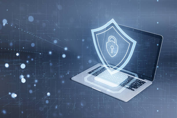 istock Laptop with a digital shield depicting cybersecurity concept on a blue tech-inspired background 2160229429