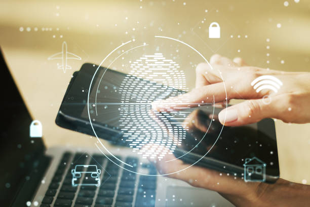 istock Multi exposure of creative fingerprint hologram with finger presses on a digital tablet on background, personal biometric data concept 2160232472