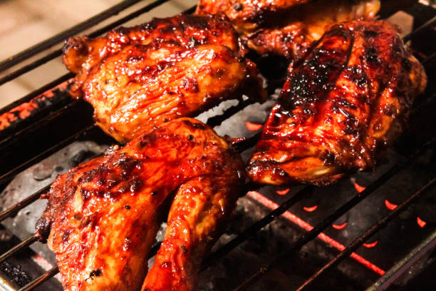 istock several pieces of chicken being grilled 2160236468