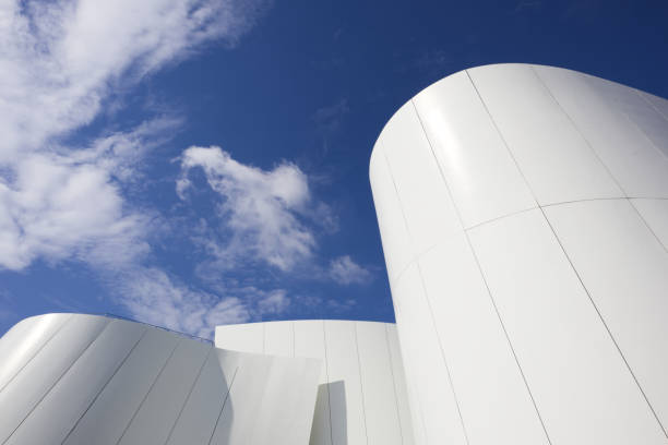 istock Construction of a white building with abstract shapes against a blue sky 2160236554